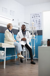Portrait of female doctor working in office