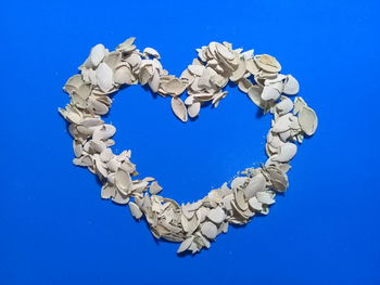 High angle view of heart shape against blue background