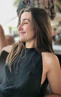 Portrait of young woman looking away