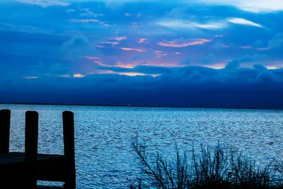 Scenic view of sea against cloudy sky