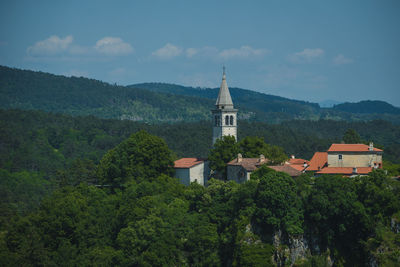 High angle view of trees and buildings against sky