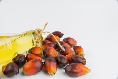 Close-up of fruits over white background