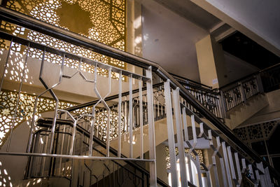 Low angle view of illuminated chandelier in building