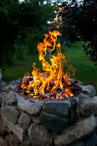 Bright flame from the fire. bonfire lighted from wood in the grill.