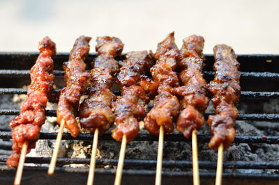 Close-up of meat on barbecue grill