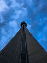 Low angle view of building against cloudy sky