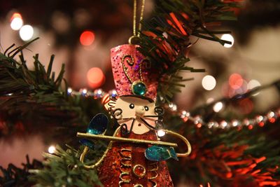 Close-up of decoration hanging on christmas tree at home