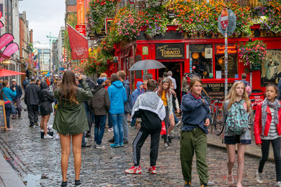 People walking on street in city