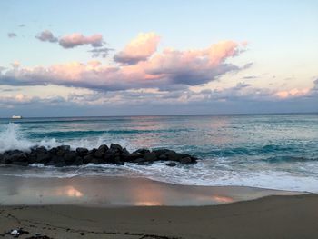 Scenic view of sea against cloudy sky