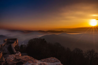 Scenic view of mountains against sky during sunset