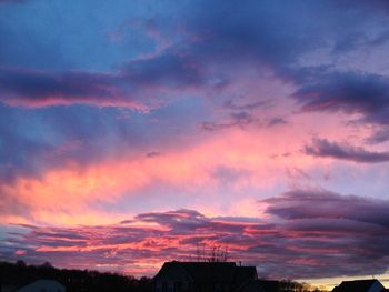 Low angle view of cloudy sky at sunset