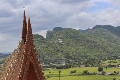 Panoramic shot of trees and buildings against sky