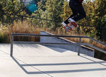 Low section of man skateboarding on skateboard