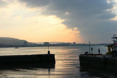 Scenic view of river at sunset