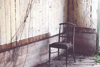 Empty chair in abandoned room