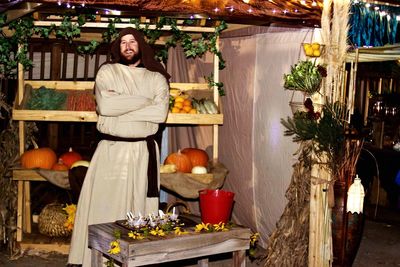 Portrait of young woman standing in traditional clothing