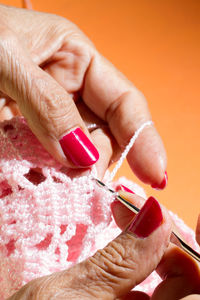 Close-up of woman knitting wool