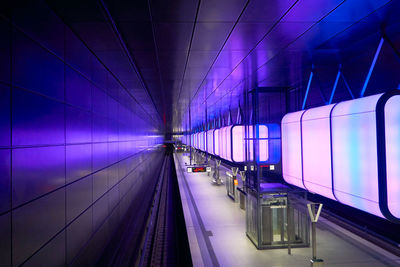 Interior of illuminated railroad station