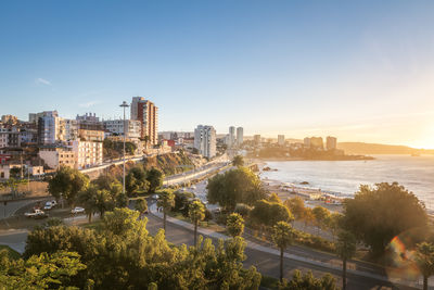 Buildings in city against clear sky