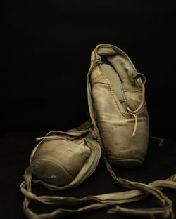 Close-up of shoes against black background