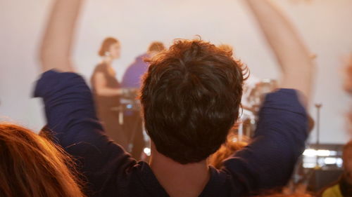 Rear view of people at home