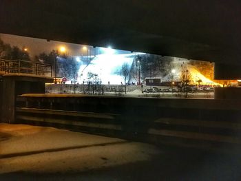Illuminated city at night during winter