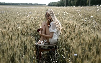 Woman sitting in a farm