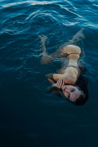 High angle view of women swimming in sea