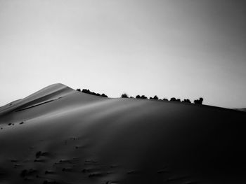 Scenic view of desert against clear sky