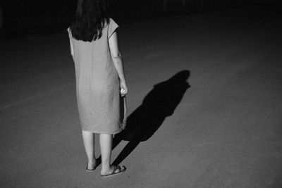 Low section of woman standing on floor