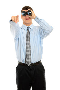 Man wearing sunglasses standing against white background