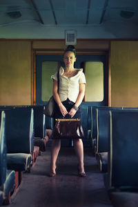 Portrait of woman sitting on chair