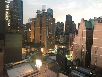 High angle view of illuminated buildings in city against sky