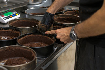 Midsection of man preparing food