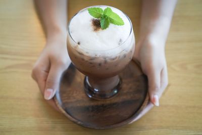 Close-up of hand holding ice cream