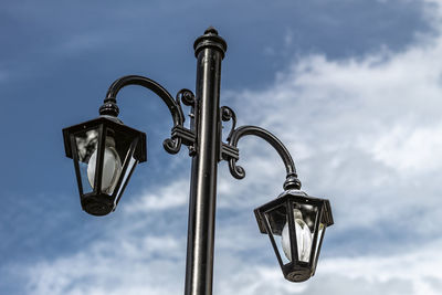 Low angle view of street light against sky