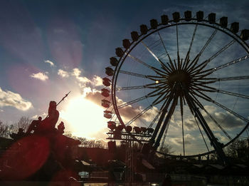 Low angle view of ferris wheel against sky