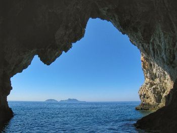 Scenic view of sea against clear blue sky