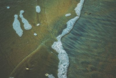 High angle view of sand on beach