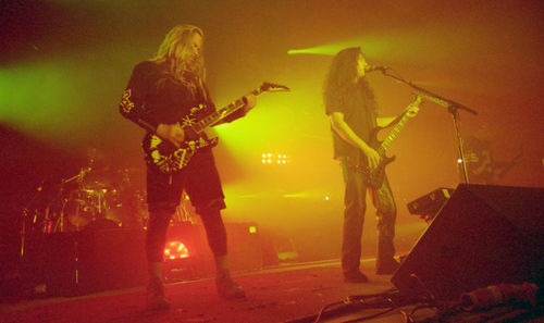 Group of people playing guitar at night