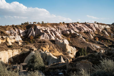 Panoramic view of rocks on land against sky