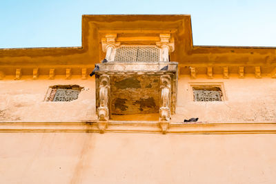 Low angle view of old building against sky