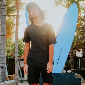 Portrait of young man standing in park