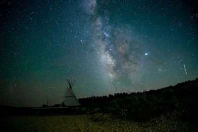 Scenic view of star field against sky at night