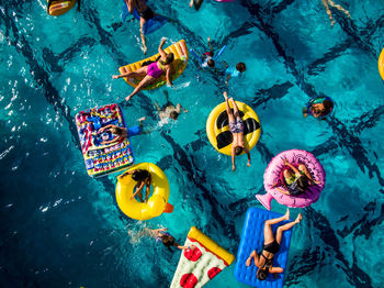 High angle view of people swimming in pool