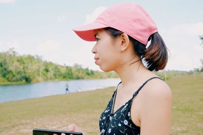 Side view of young woman looking away