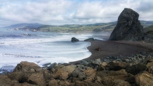 Scenic view of beach against sky