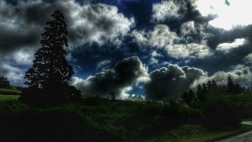 Scenic view of landscape against cloudy sky