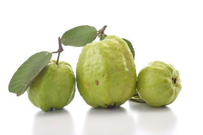 Close-up of fruits against white background