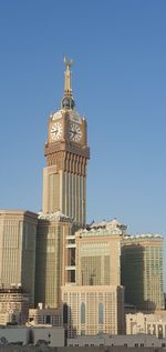 Low angle view of building against blue sky